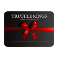 A black gift card from Truffle Kings with a red ribbon bow, representing a luxury gourmet gift.